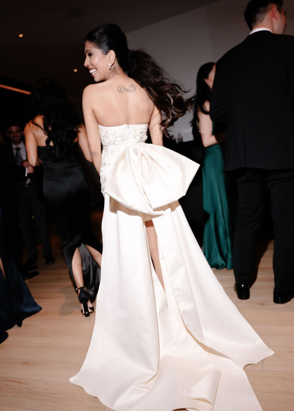 Bride at Public Hotel in NYC wearing a short, white dress with a large bow