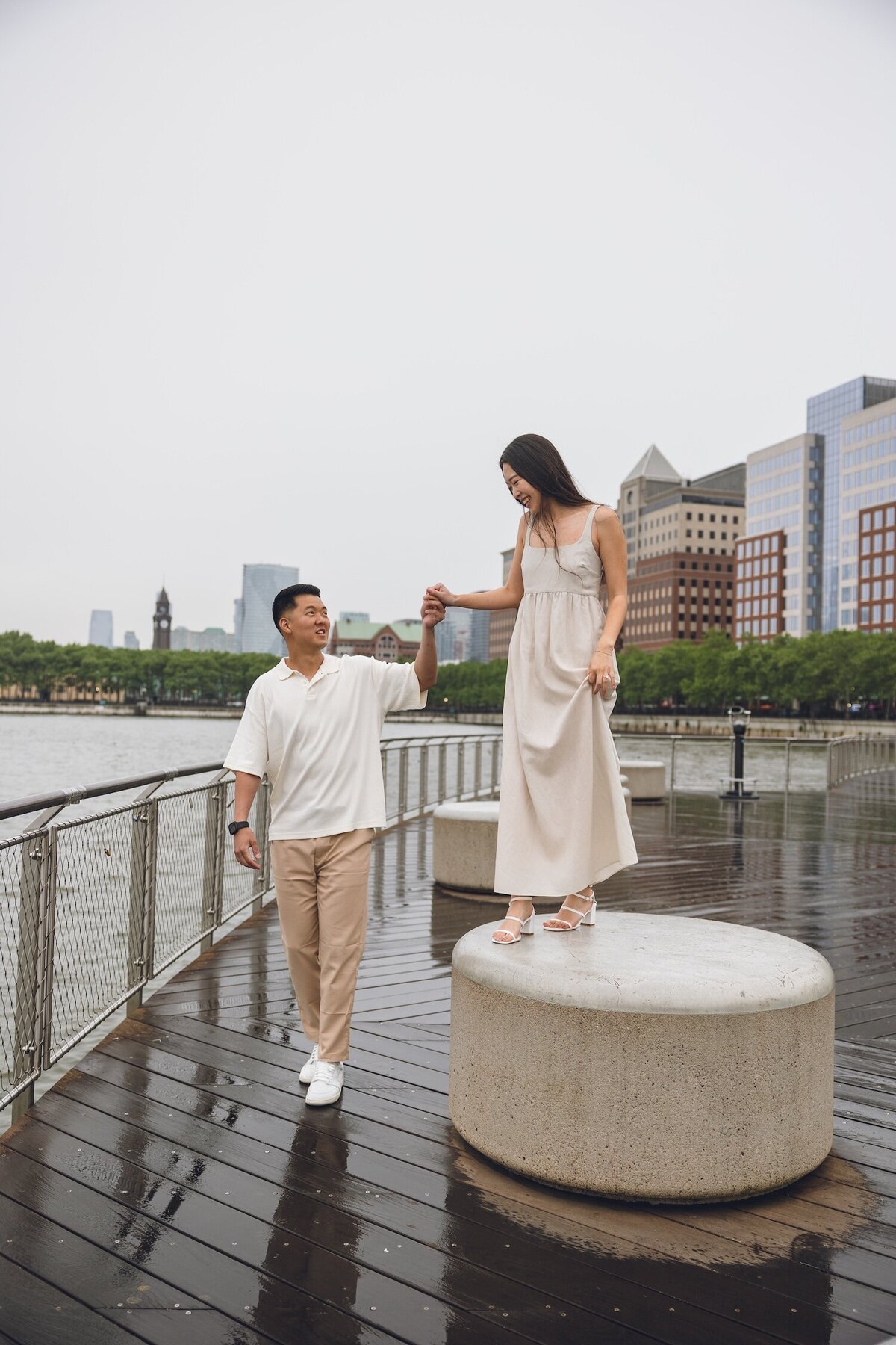 Couple walking hand-in-hand along Hoboken waterfront