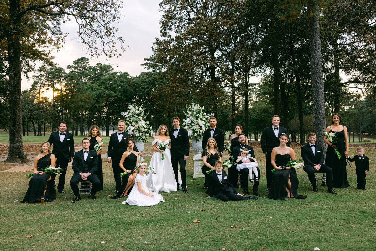 A wedding photo of the bride and groom and their full bridal party