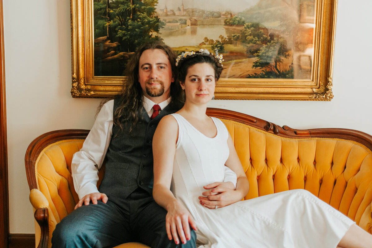 bride-and-groom-in-front-of-couch