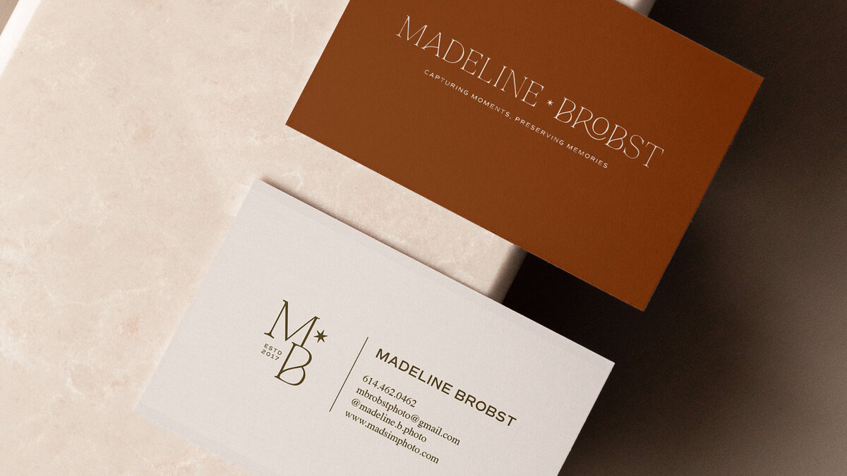 Business card design on neutral earth tone background