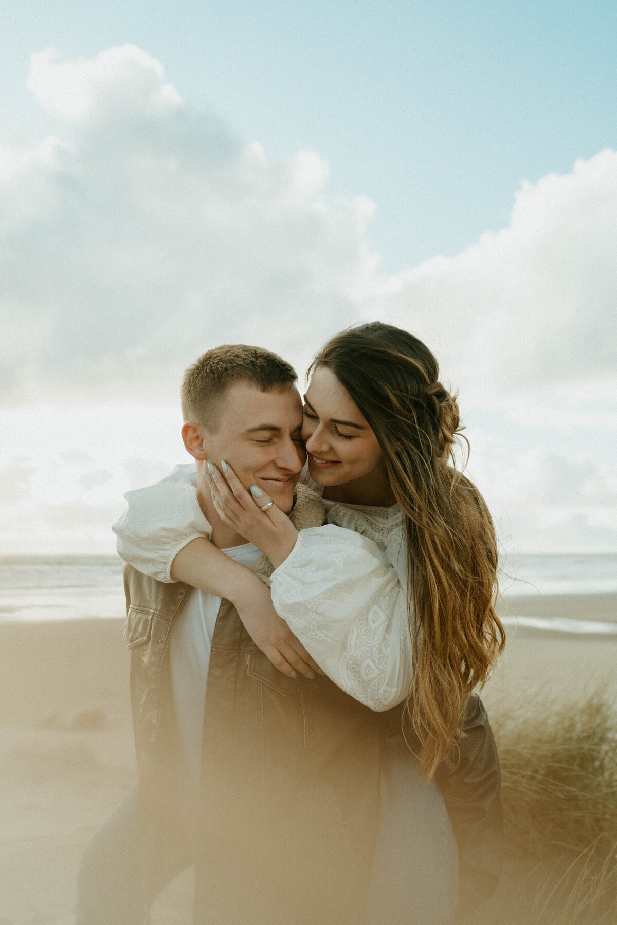 couple walking in a field in the mountains