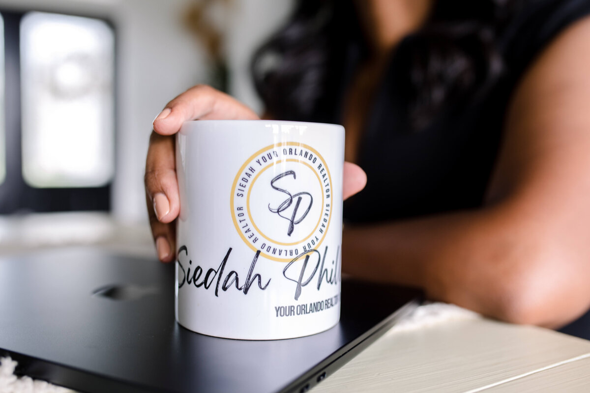 brand photography with woman holding a branded coffee mug captured by Orlando photographer