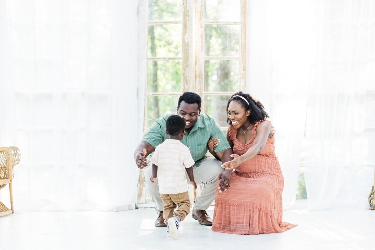 family embraces for a photo in houston studio