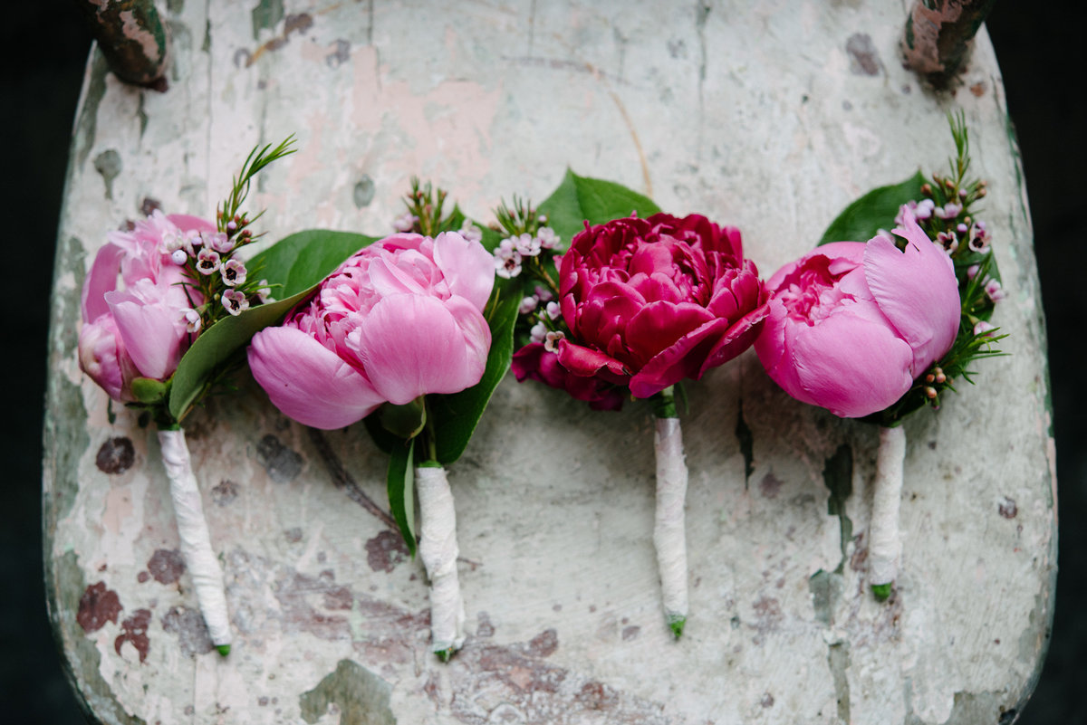 pink and red roses boutonnieres