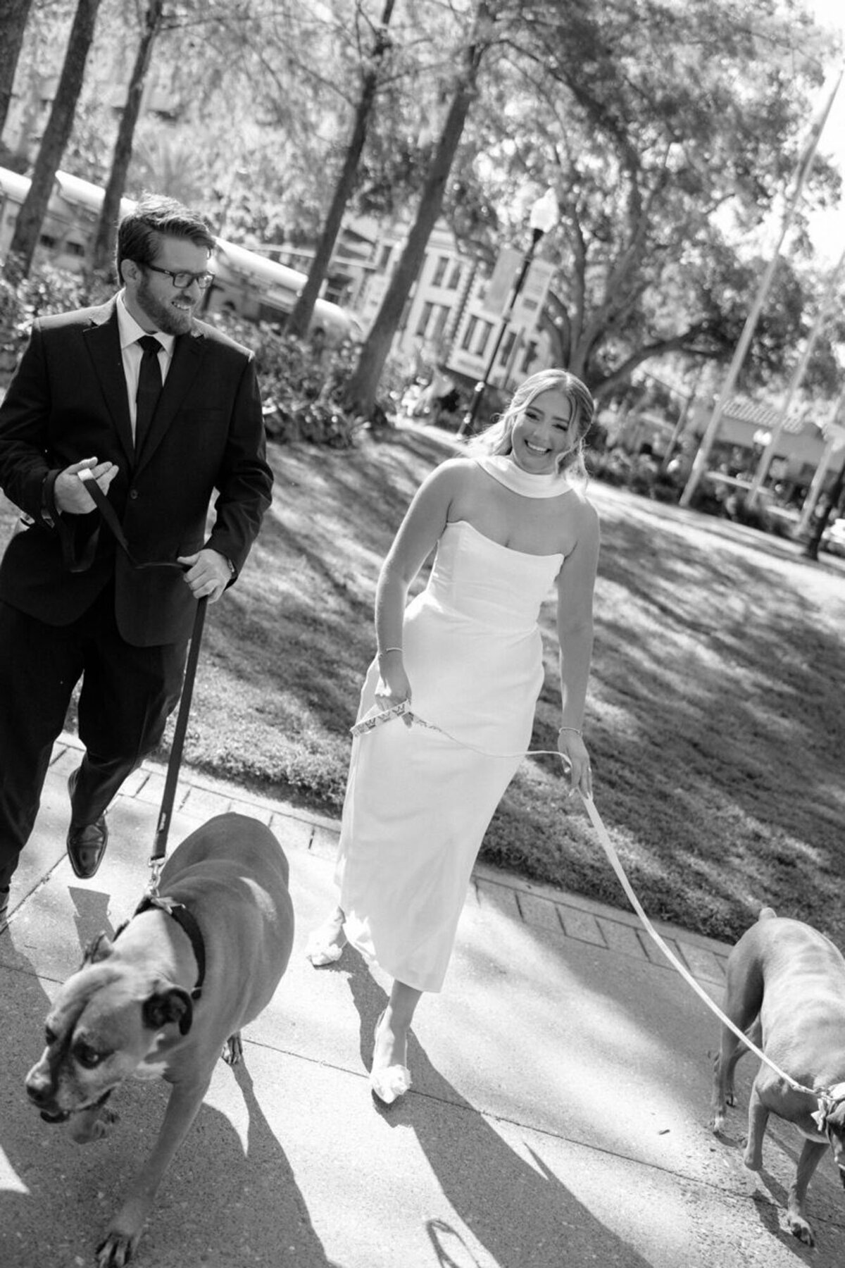 Bride and groom with their dogs, taken by Orlando photographer Marissa Nicole