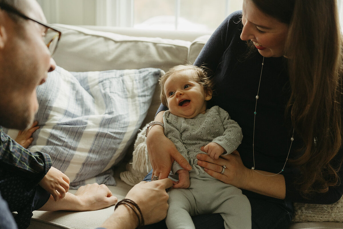 baby smiling during newborn photos captured by NYC newborn photographer Elsie Goodman 
