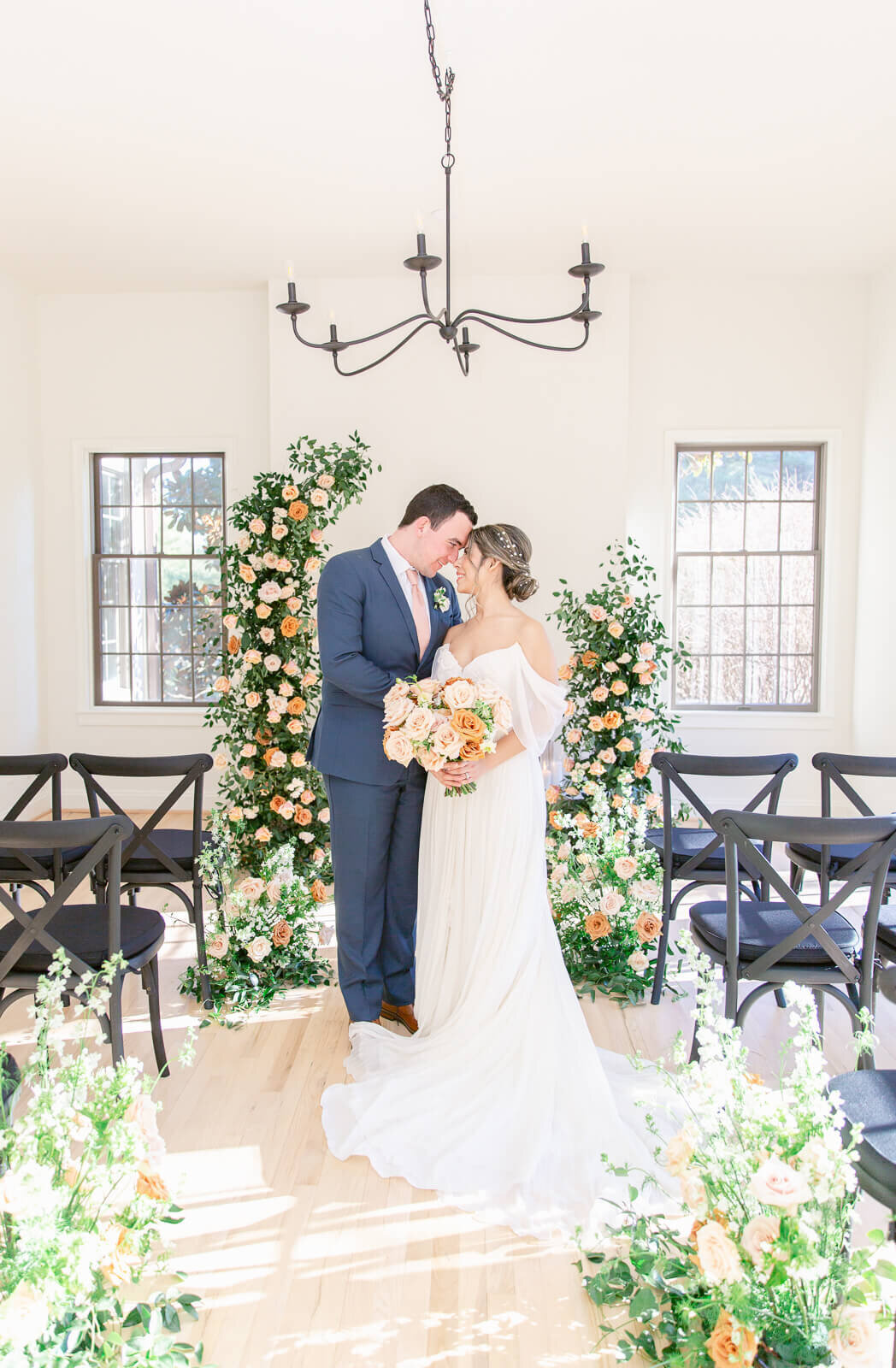 Bride and Groom gaze into each other's eyes during wedding portraits at a modern Virginia wedding venue in Loudon County. Taken by Bethany Aubre Photography.