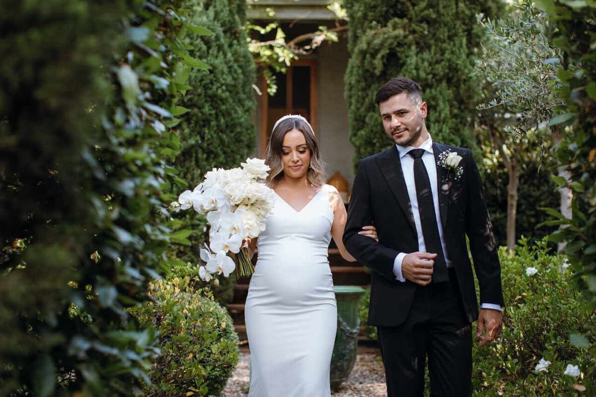 bride_groom_walking_in__garden
