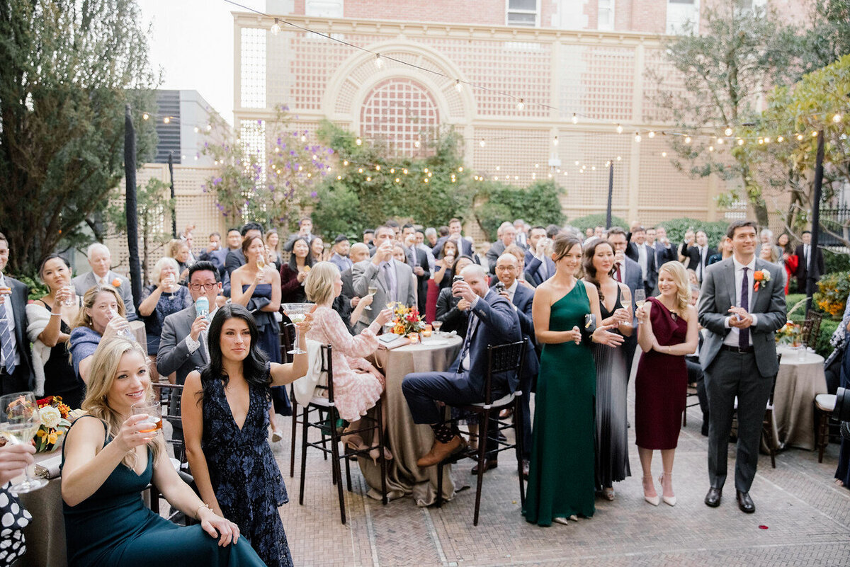 Wedding guests gathered in courtyard