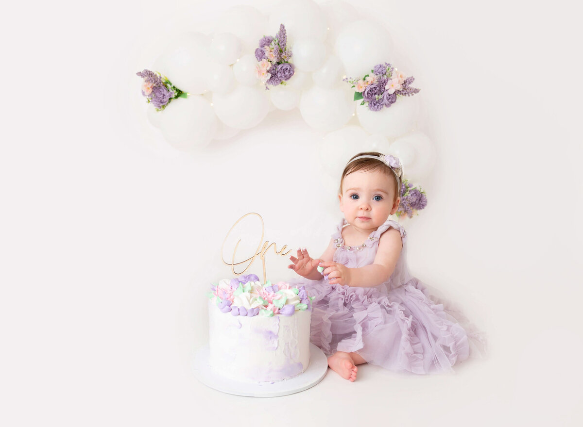 Lavender cake smash session for baby girl By Brooklyn cake smash photographer 