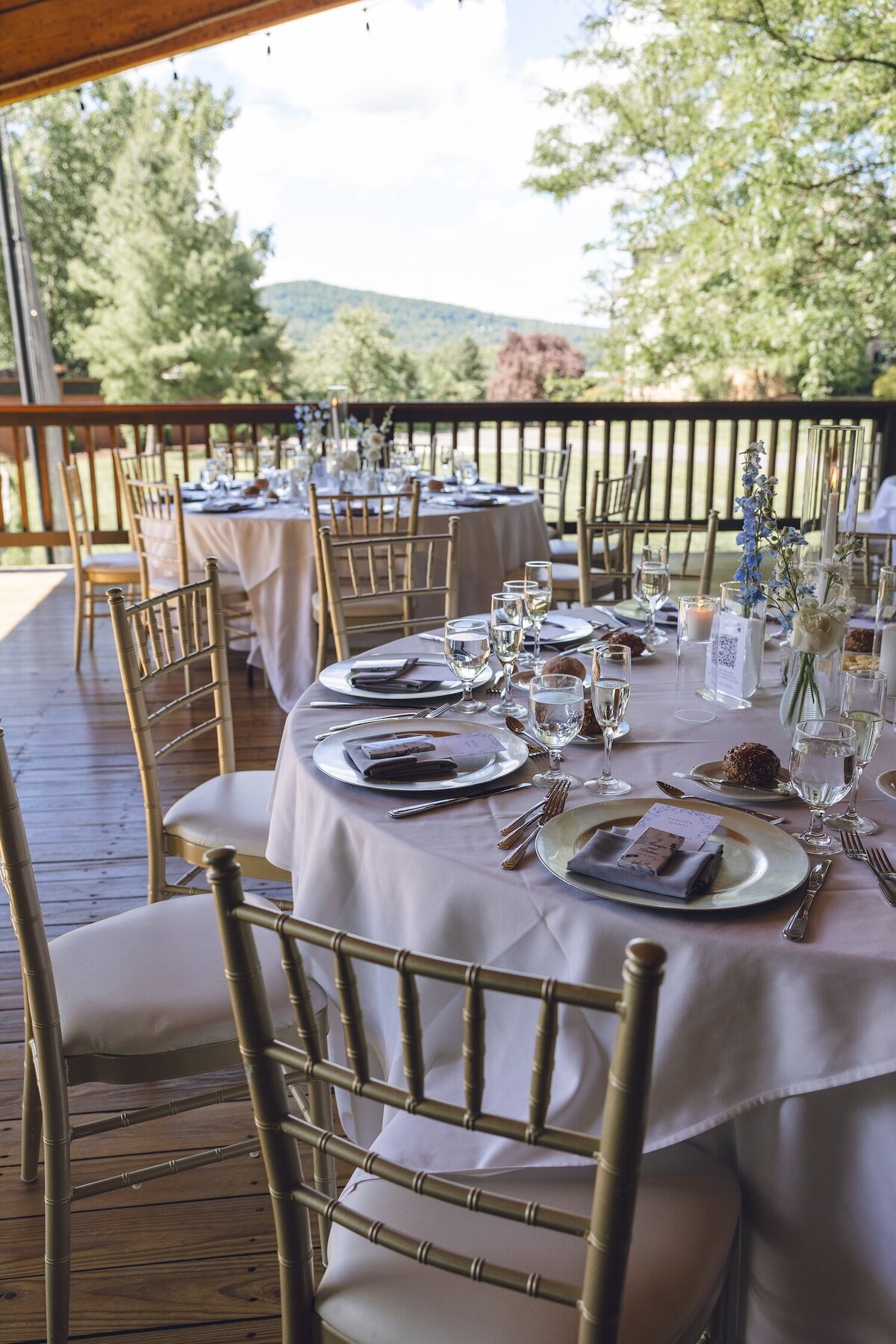 Outdoor reception tables set for wedding dinner at Crystal Springs Resort