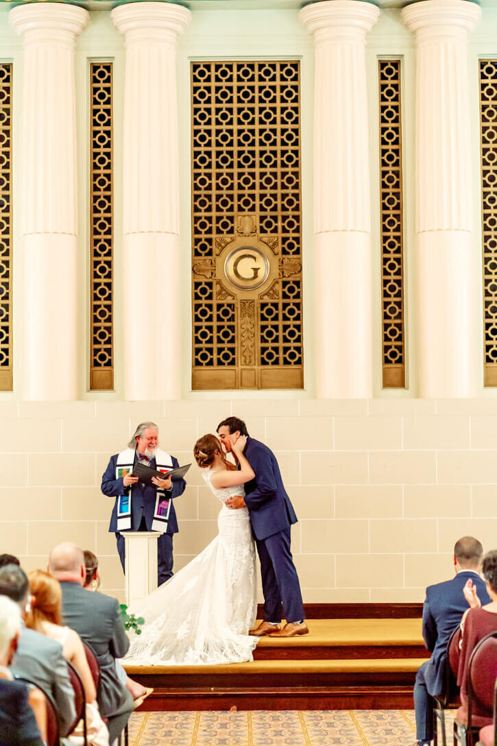 Bride and Groom sharing their first kiss at the altar after their ceremony was complete.