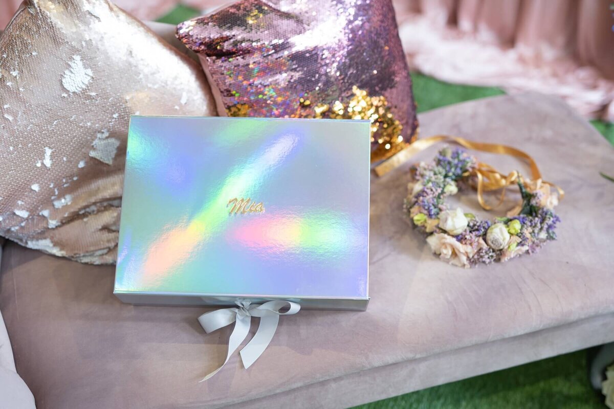 Rainbow gift box with floral bracelet and glitter pillows