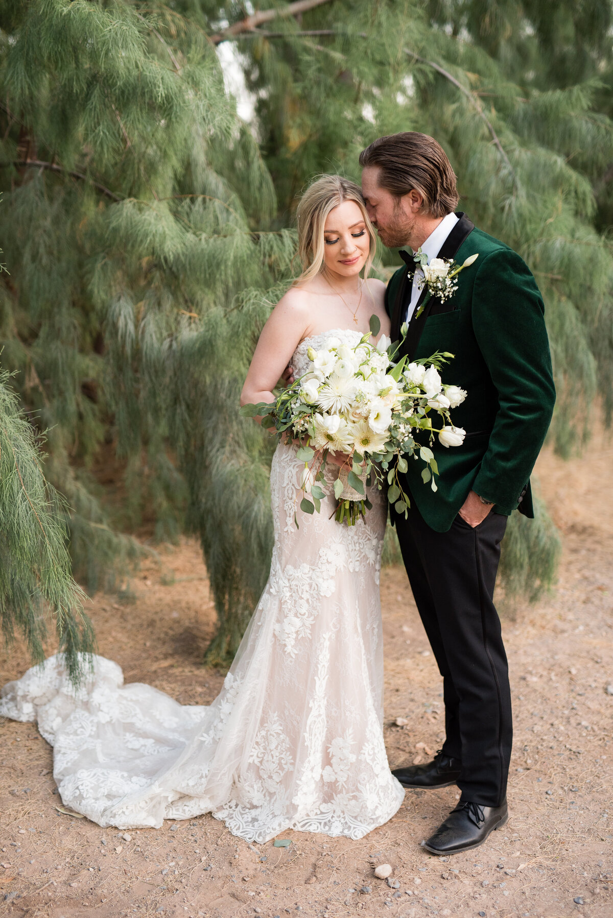 Bride and groom share a tender moment  during golden hour at The Secret Garden - Wedding Venue in the Las Vegas Desert.