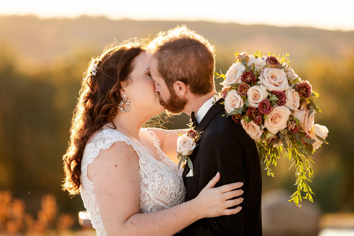 Bride and grooms first kiss at Pembroke Pines Country Club by Lisa Smith Wedding Photographer
