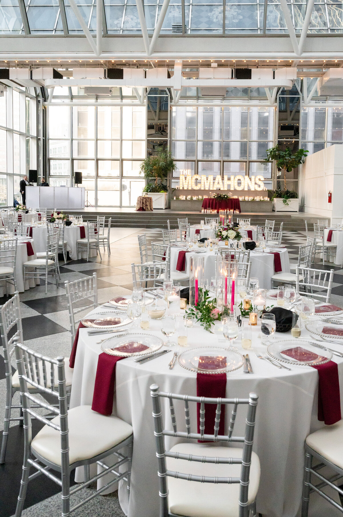 wedding reception setup for wintergarden ppg place event with white table cloths and red napkins march event