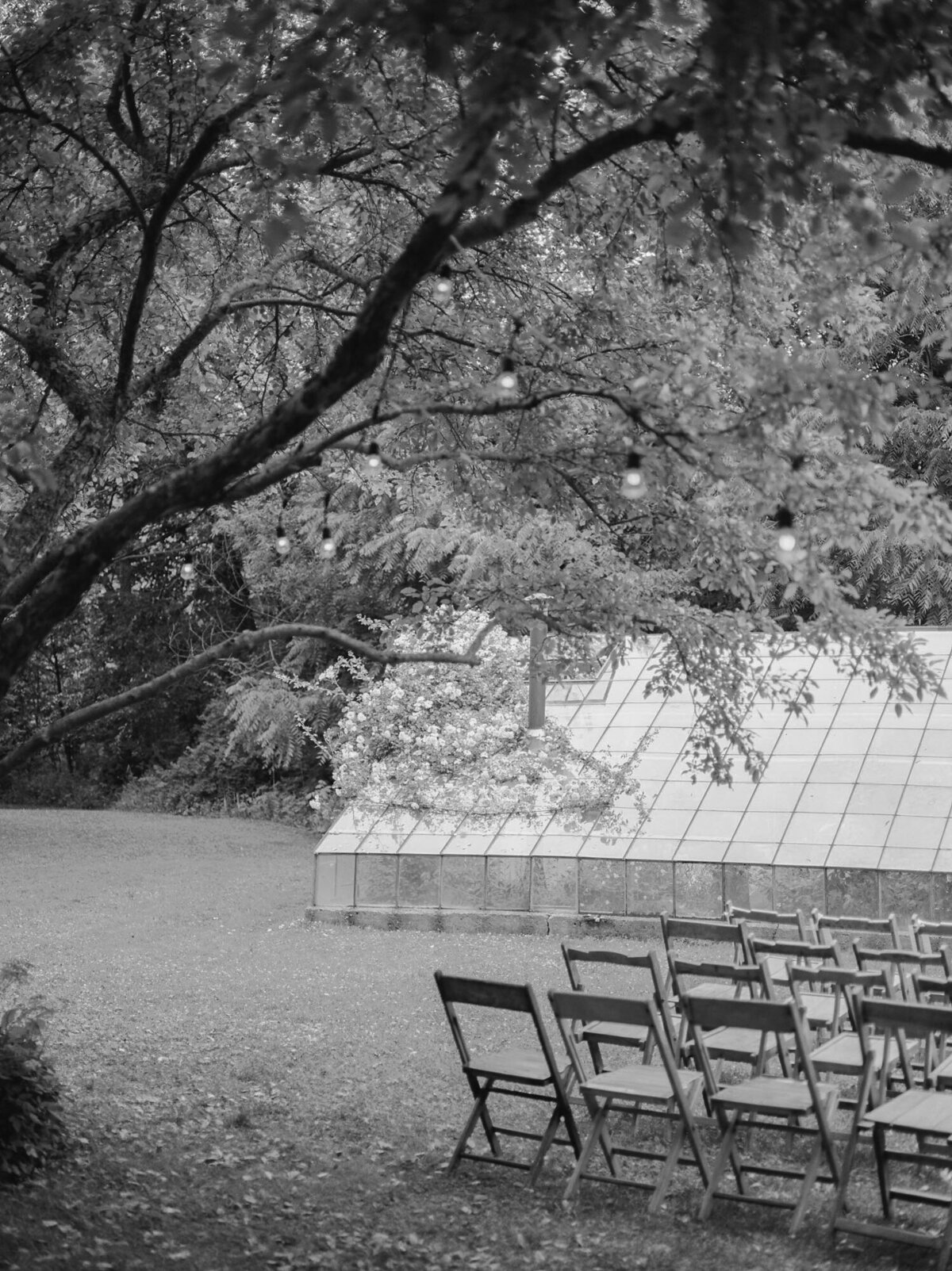 wood wedding ceremony chairs in Michigan, Glass House Community