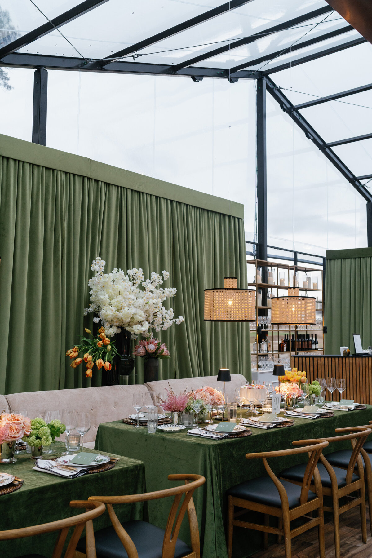 Tented wedding reception at Brook Hollow Golf Club with large trees