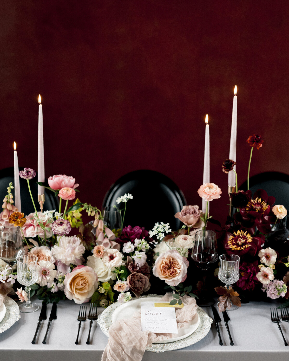 Gorgeous, natural floral centrepieces line the table at a Chateau St Agnes wedding reception.