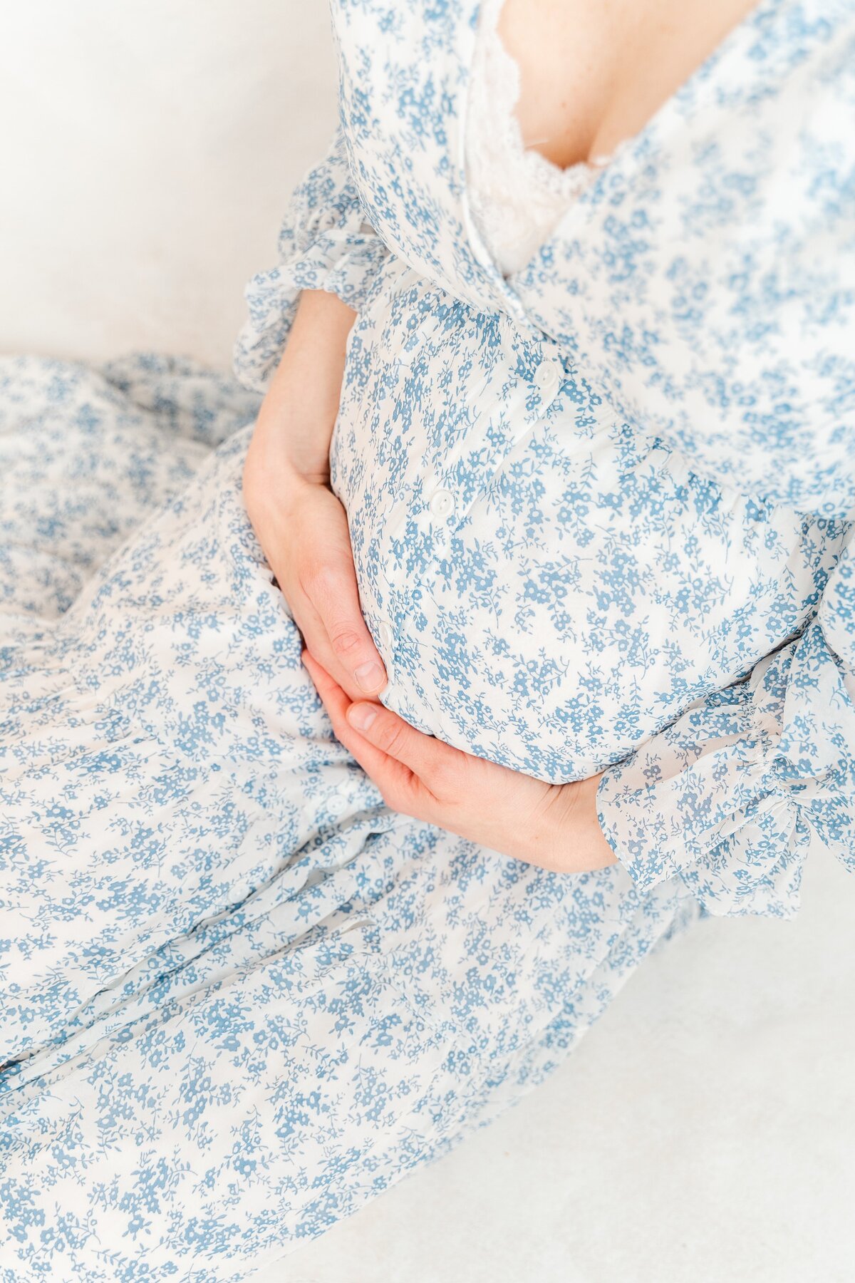 Image of pregnant woman in blue floral maternity gown for Chattanooga maternity photography photoshoot