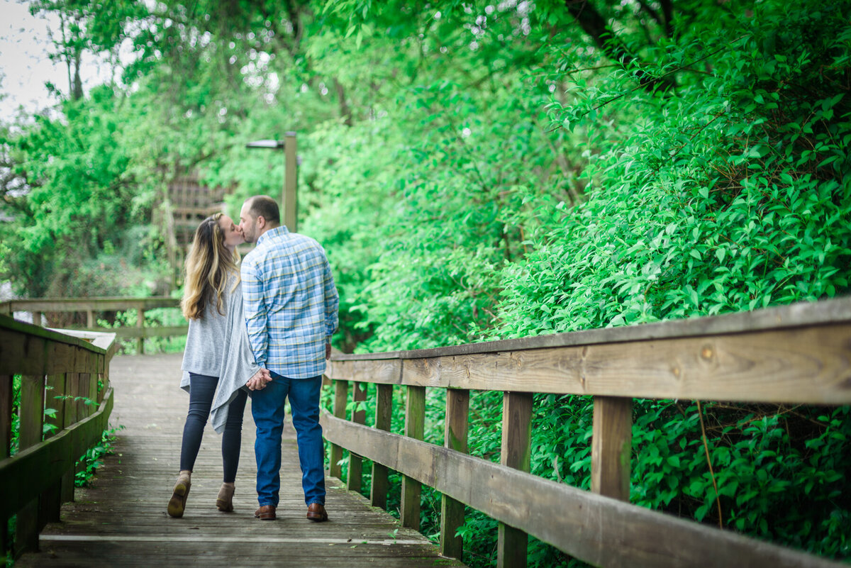 couple kisses walking down boardwalk  cuyahoga falls
