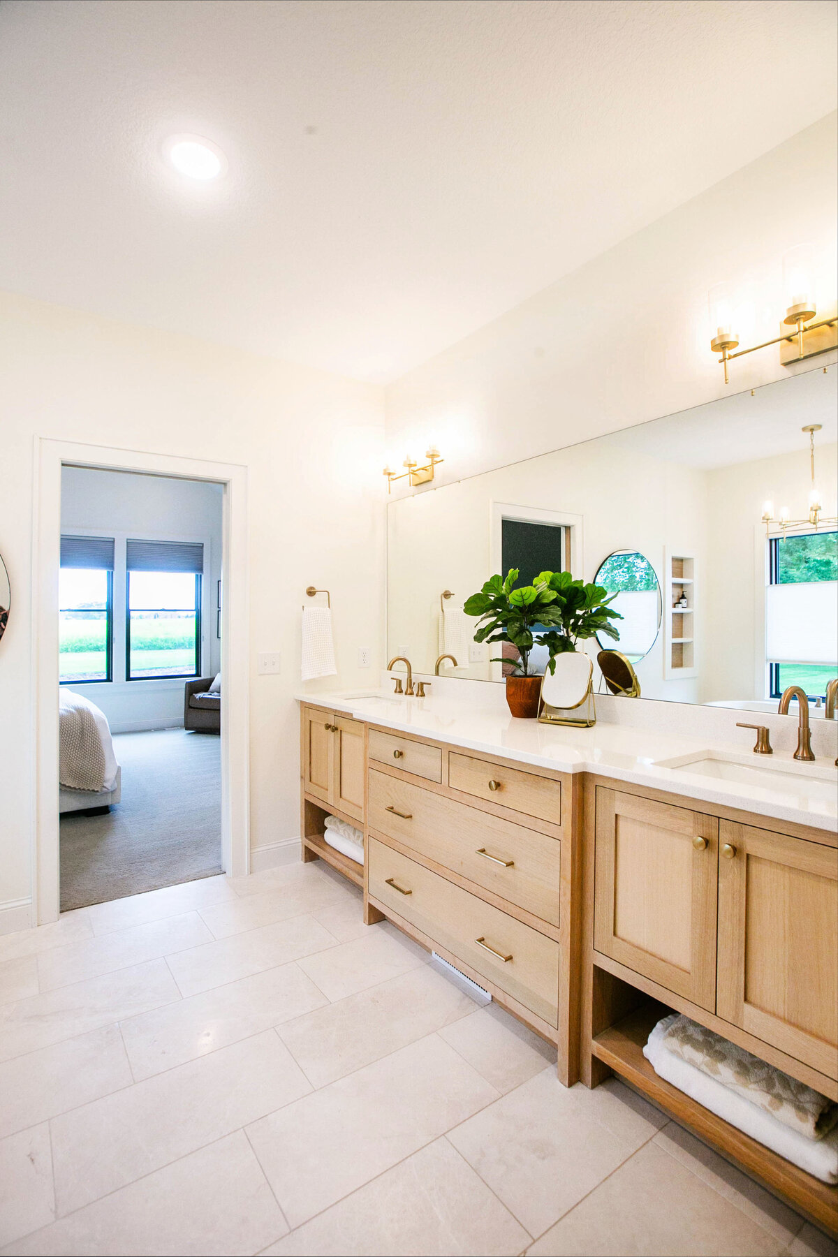 Custom bathroom with soaking tub, double vanity, and walk-in shower in Otsego custom home