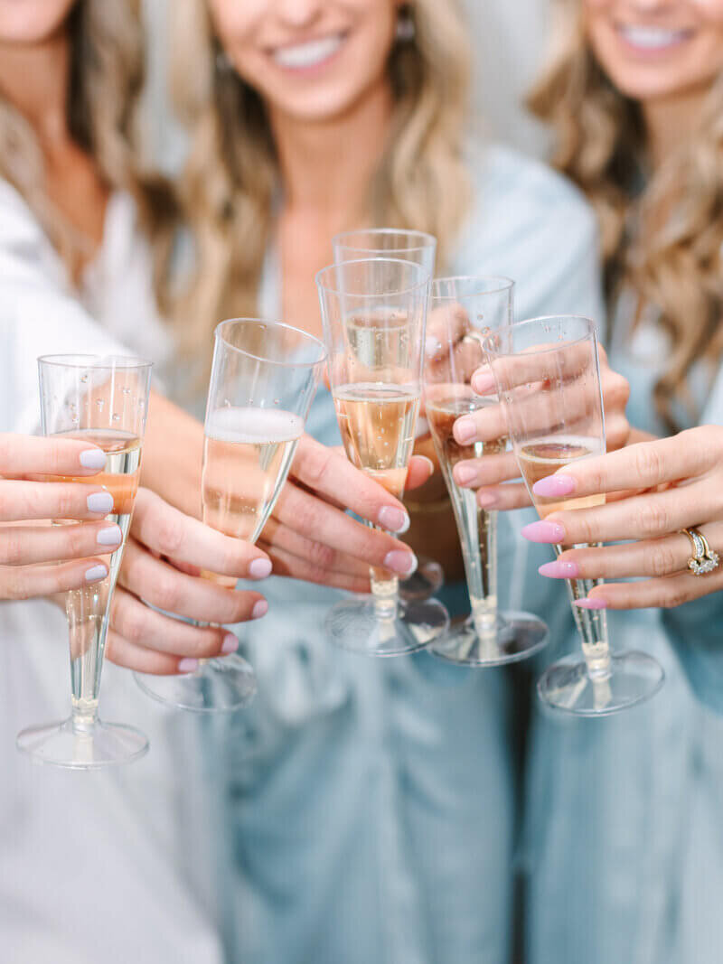 Cheers with bridesmaids to show planning a wedding in chicago