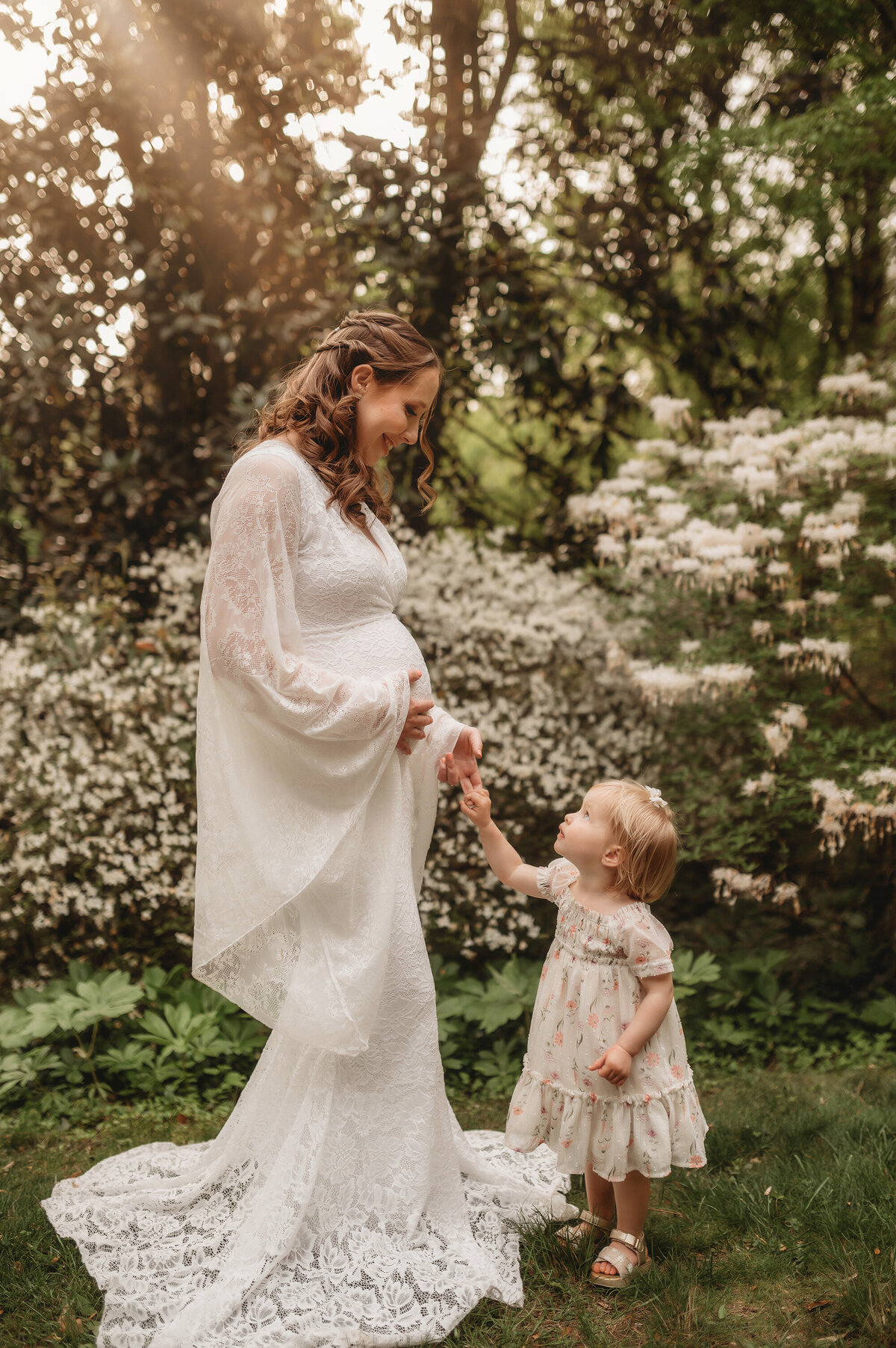 Pregnant woman interacts with her toddler during Maternity Photos in Charleston, SC.