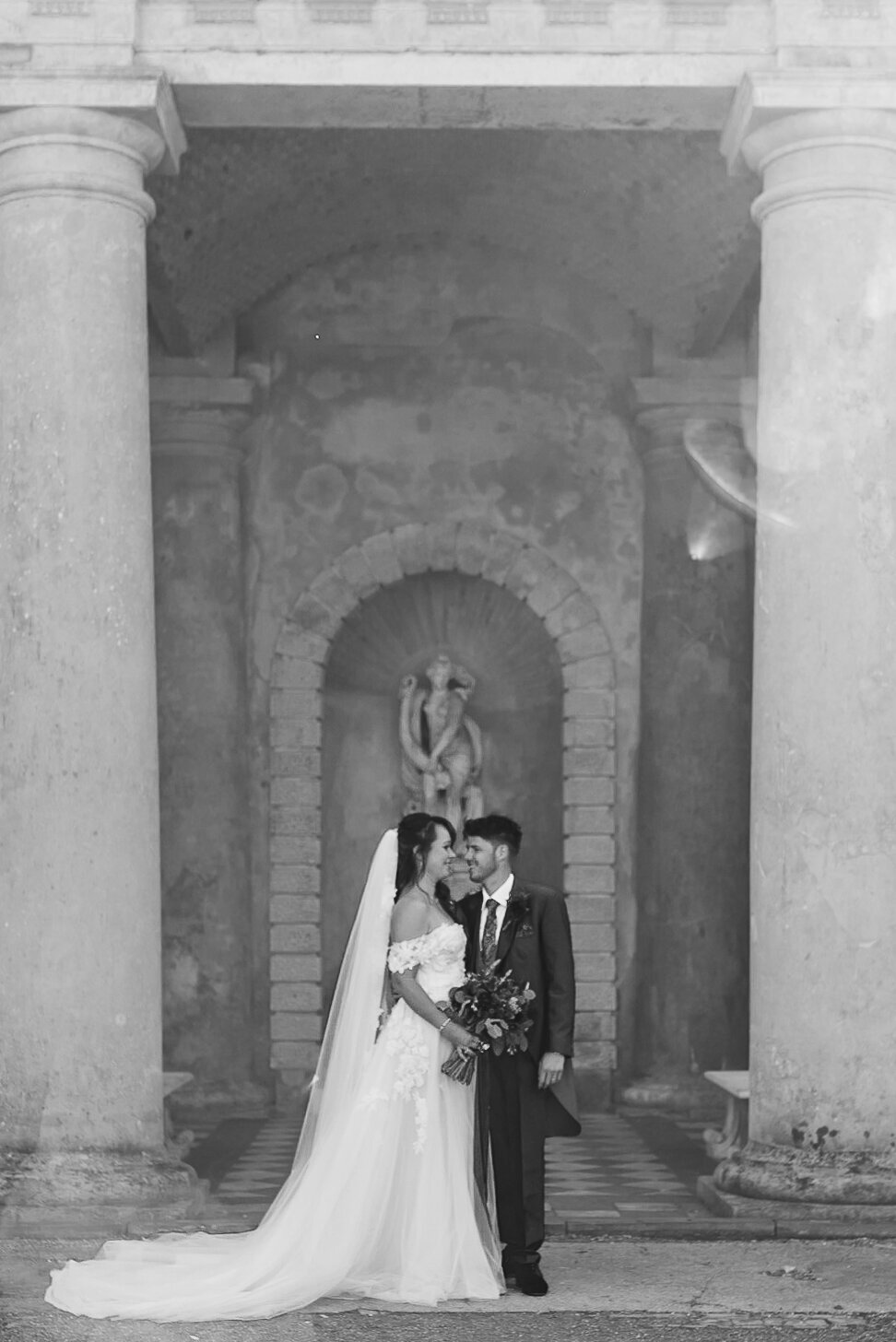 Black and White image of a bride and groom at wotton house in surrey hills