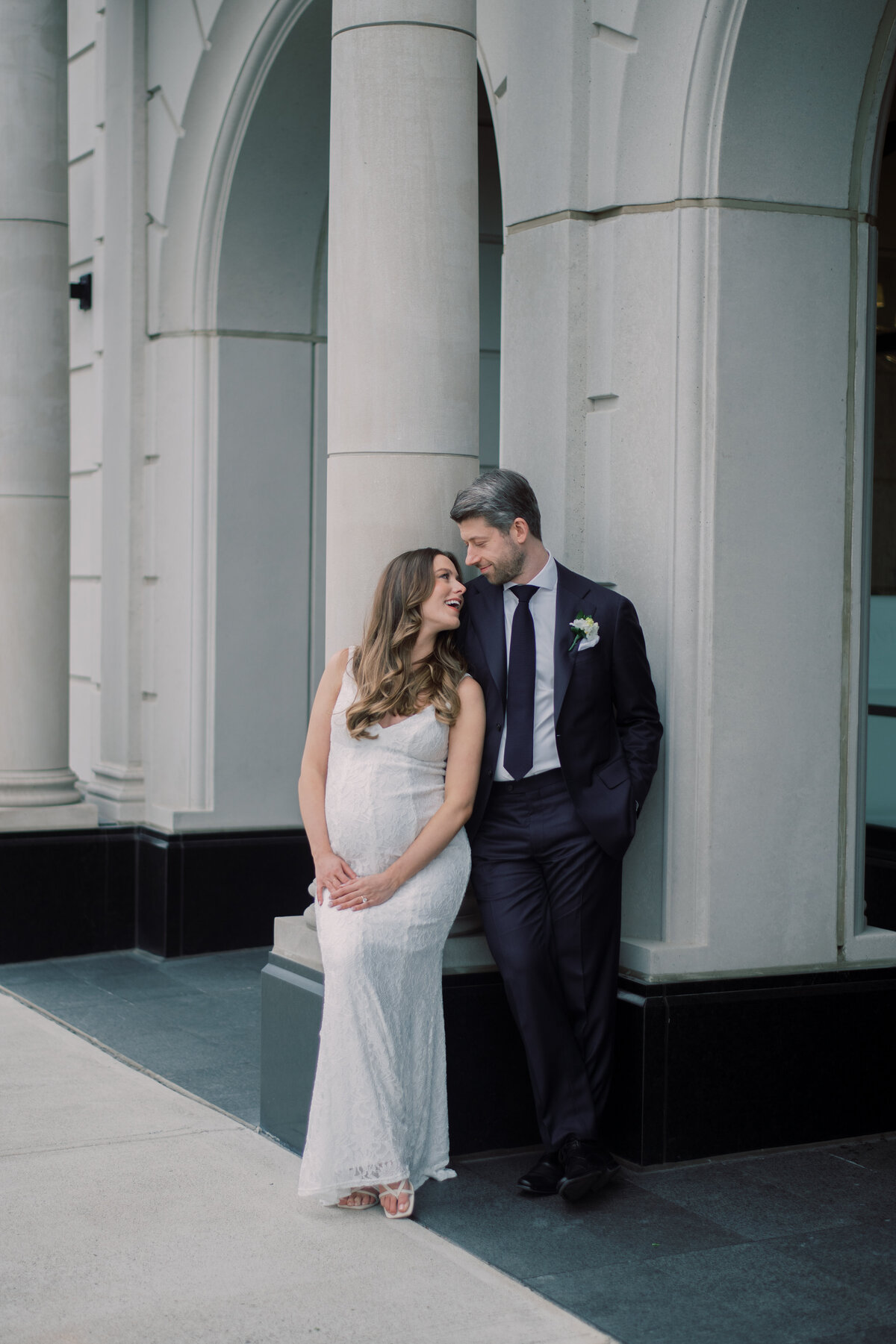 bride and groom have a moment looking at each other in love. 