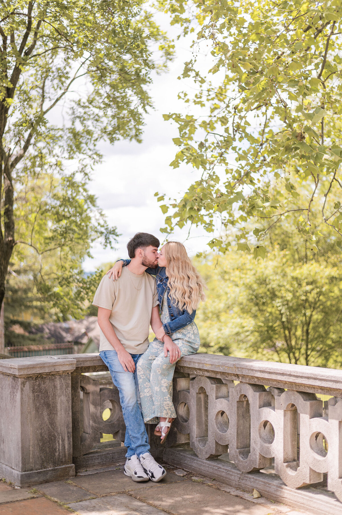 Newlyweds sharing a kiss at the best Pittsburgh photoshoot location - captured by Bree Stewart of LLP. 