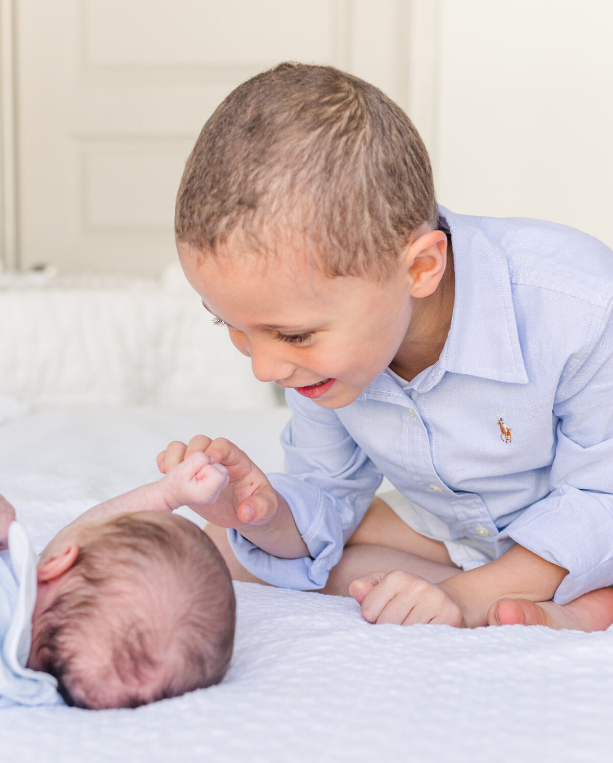 toddler boy playing with with newborn | by Atlanta newborn photographer Laure Photography