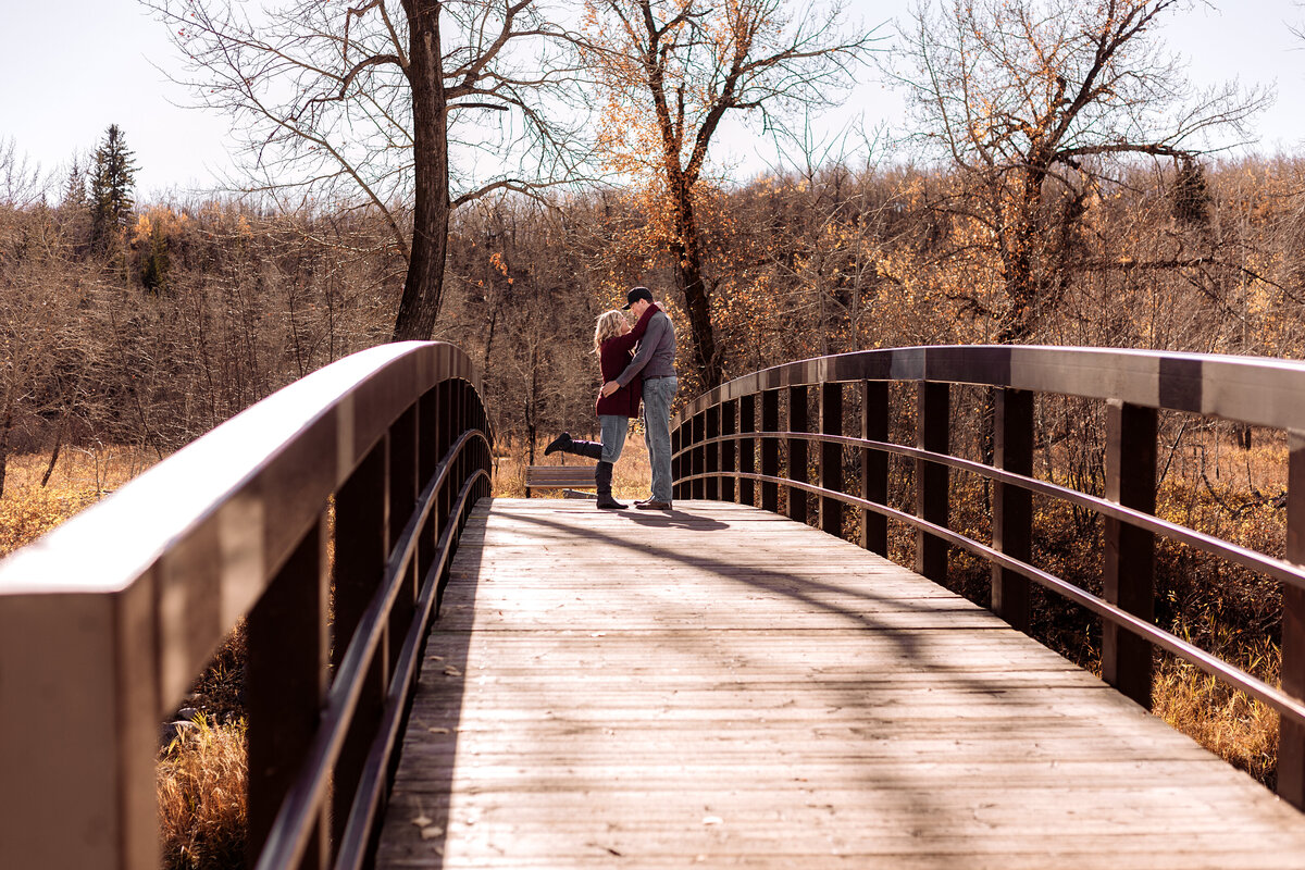 engaged-couple-on-bridge
