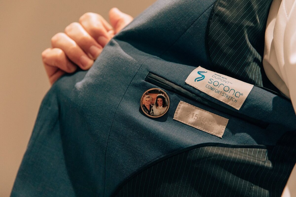 groom has a special button of his grandmother in his suit