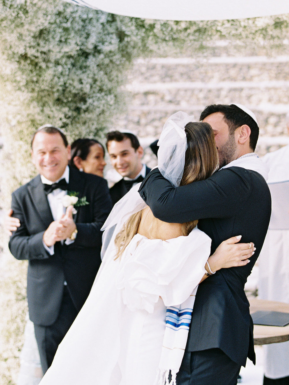 Couple hugging during their caribbean destination wedding