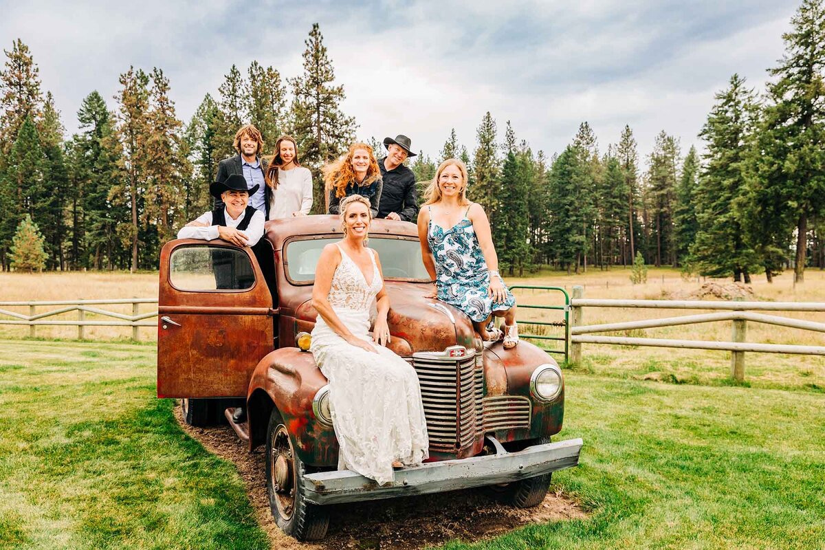 Bride and groom with friend on antique truck, The Silver Knot, Ronan, MT