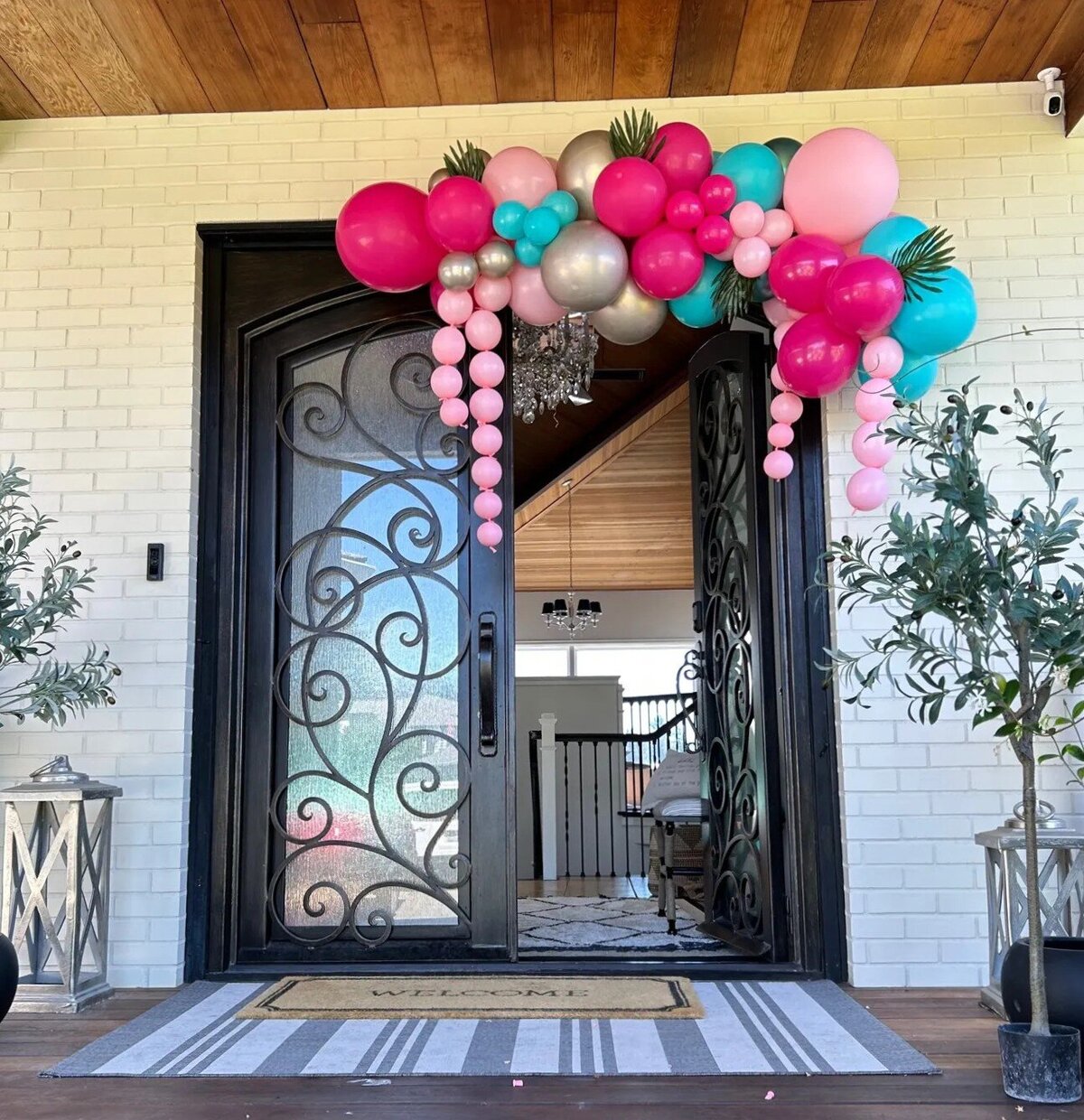 balloon decor for doorway - pink and teal