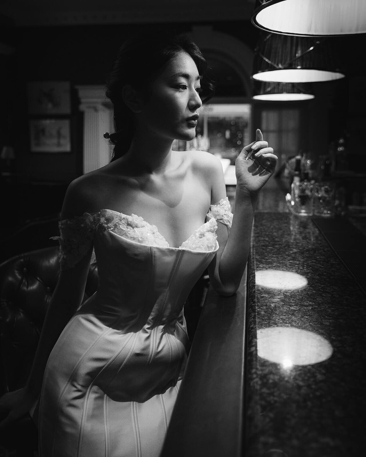 Bride orders a cocktail at a bar