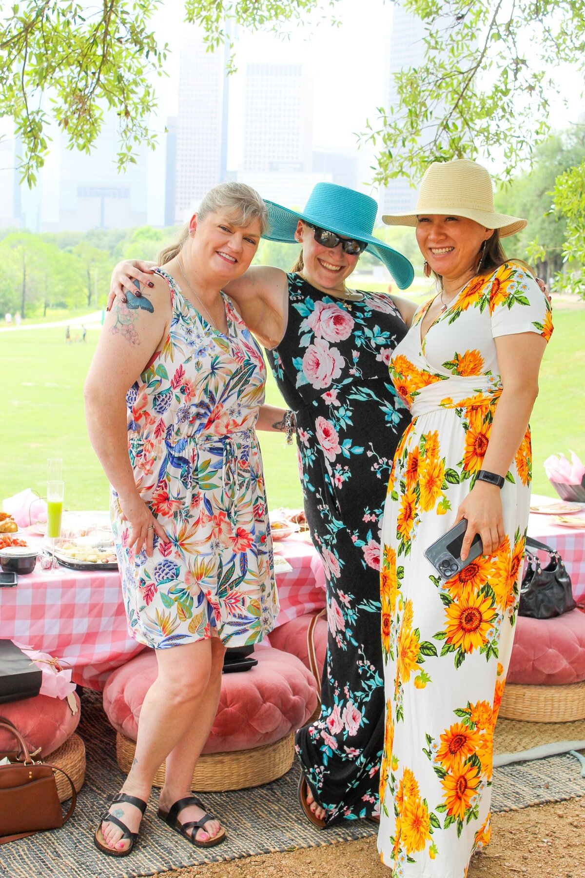 Guests in sundresses at a luxury picnic