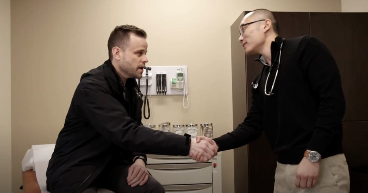 white man shaking hands with Asian doctor healthcare video