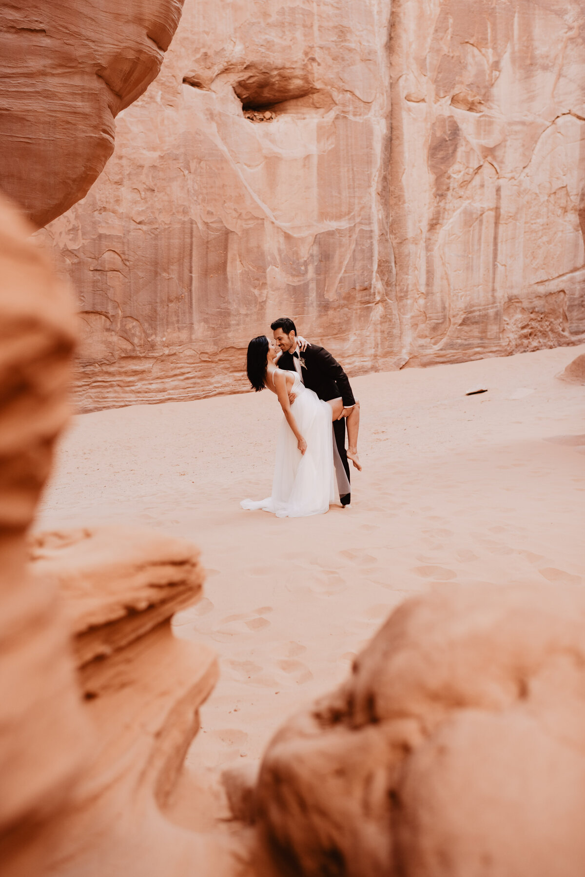 Utah elopement photographer captures couple kissing during bridal portraits