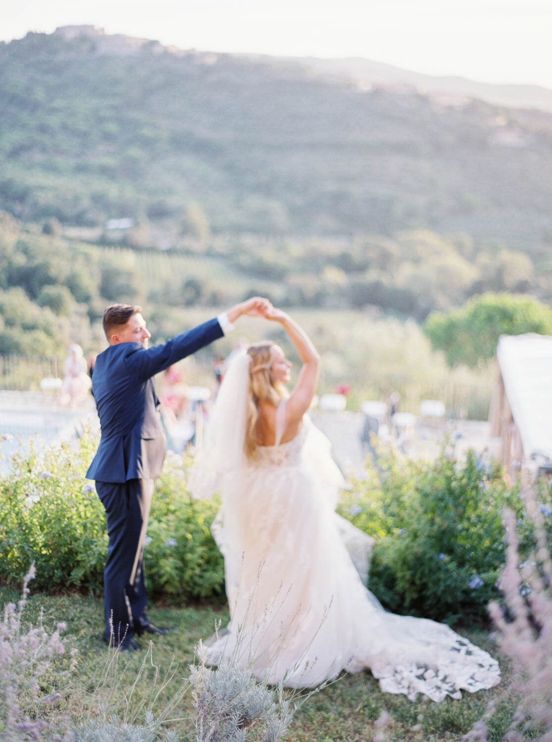 Bride and groom dancing in. tuscany