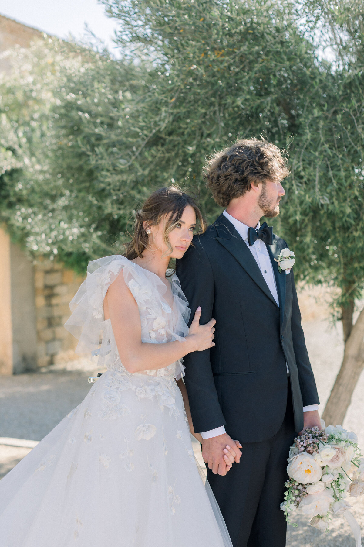 romantic-bride-groom-holding-hands-emotional-connection-outdoor