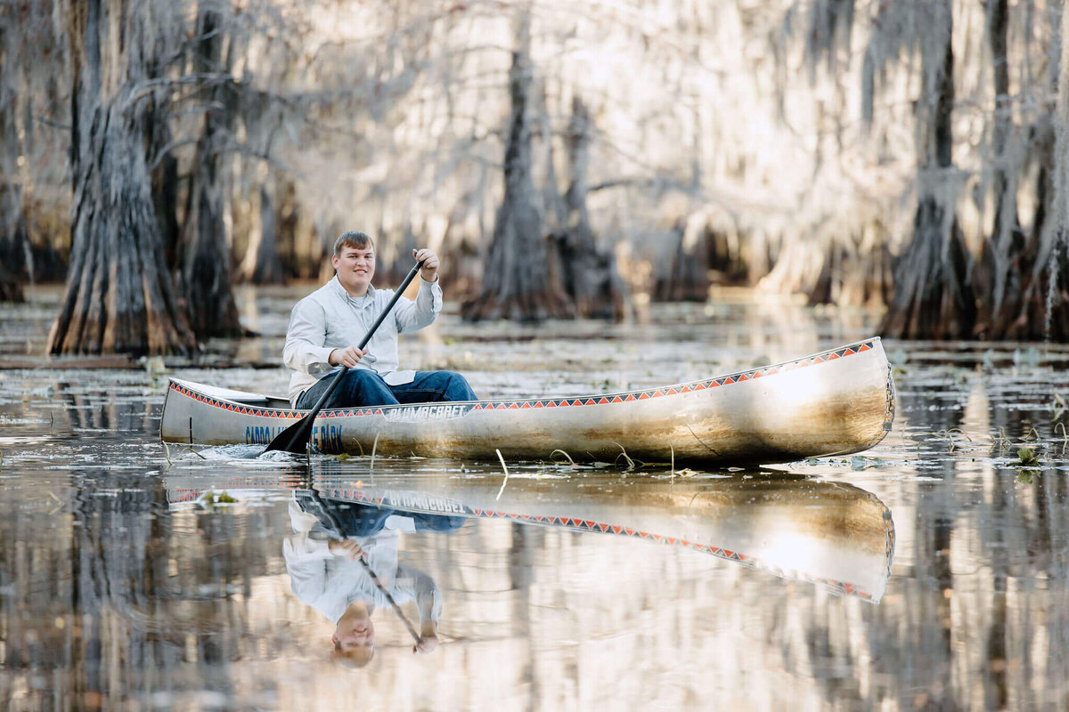 2024 graduate in canoe at Caddo State Park