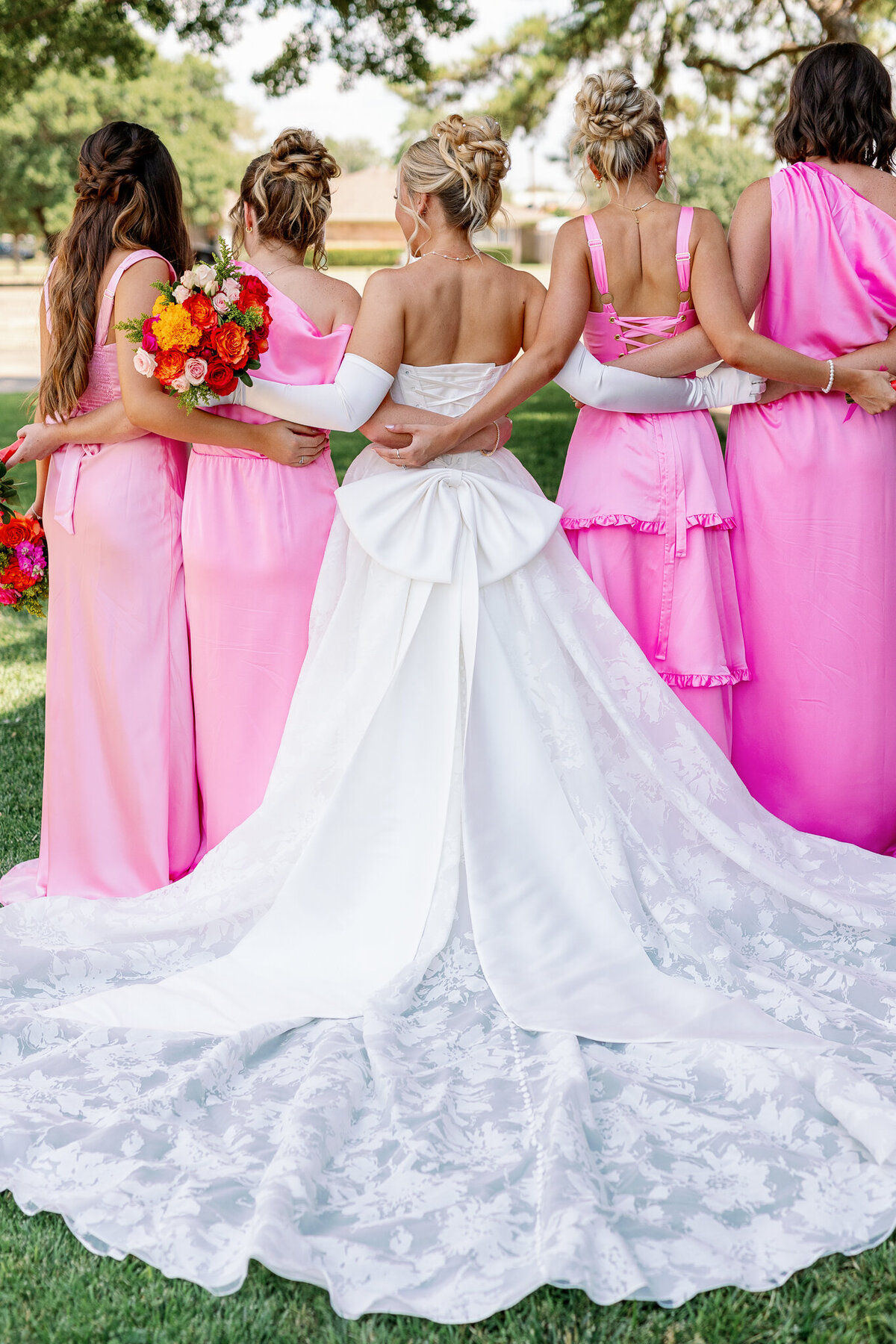 Bright and vivid image capturing the love between a bride and her bridesmaids