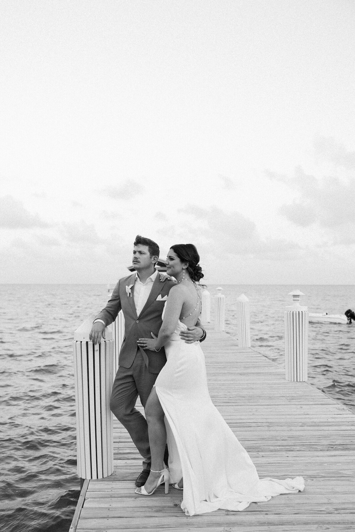 Couple posing on a dock, photographed by Miami wedding photographer Claudia Amalia, showcasing her wedding photography in Florida Keys.