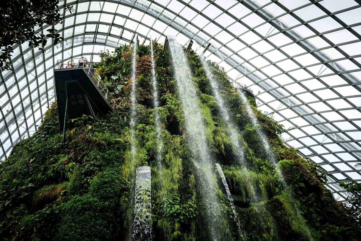 Looking up at a waterfall inside the ArtScience Museum in Signapore