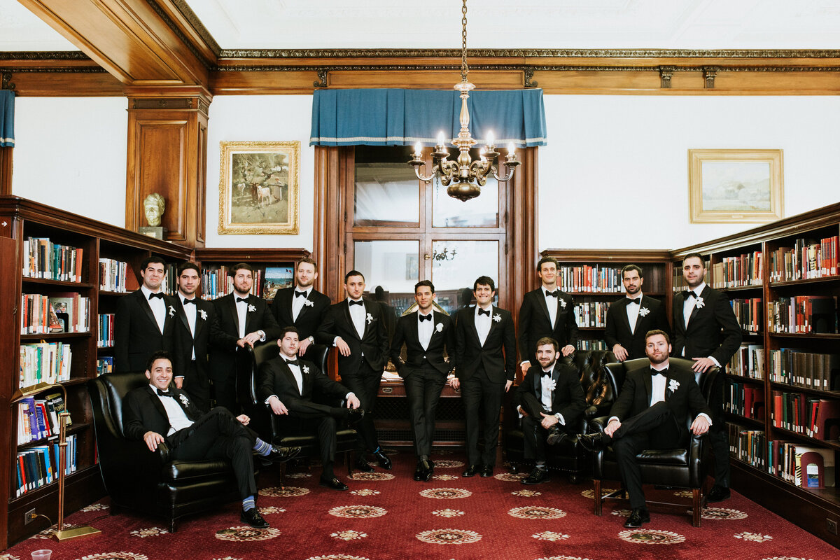 Groomsmen standing together in library