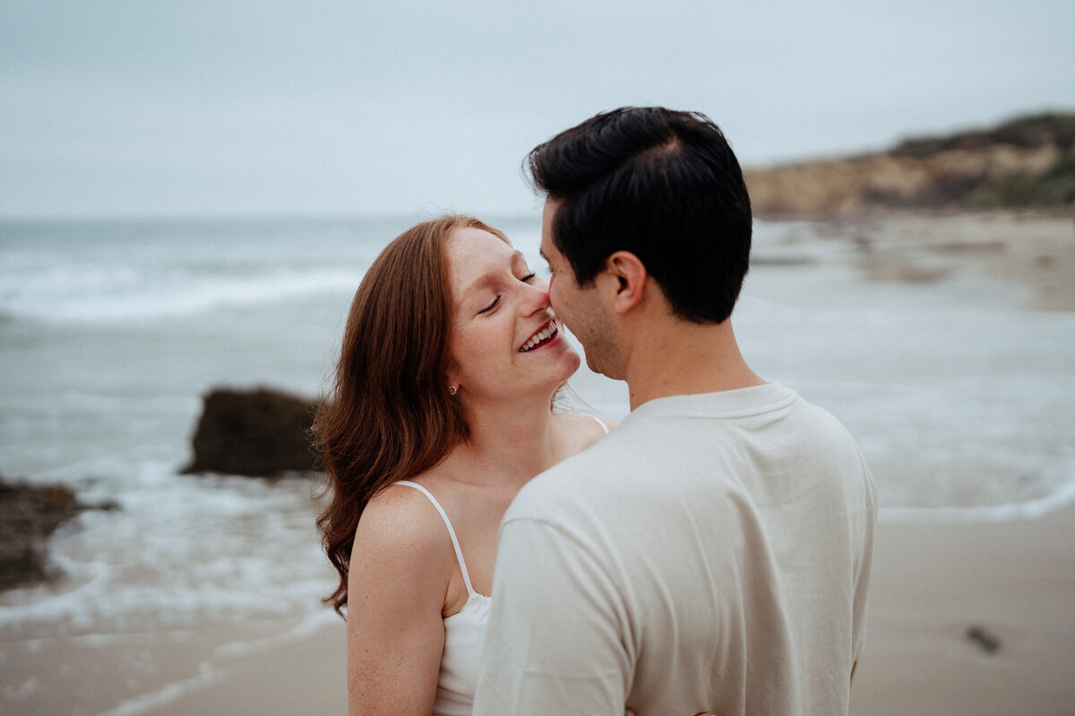 couple shoot for maternity session during golden hour Oregon coast beach wedding/elopement - photographed by The Storytellers